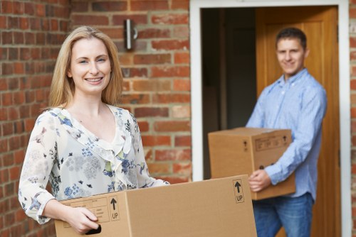 Professional movers loading furniture into a van