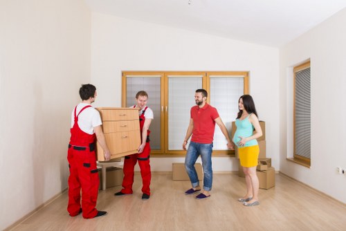 Recyclable furniture and boxed materials being sorted for charity reuse and waste separation