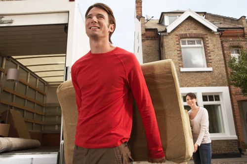 Professional team collecting bulky furniture from a home