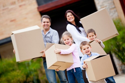 Local customers preparing boxes and furniture for removal truck hire