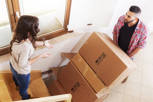 Packed moving boxes and furniture ready for transport