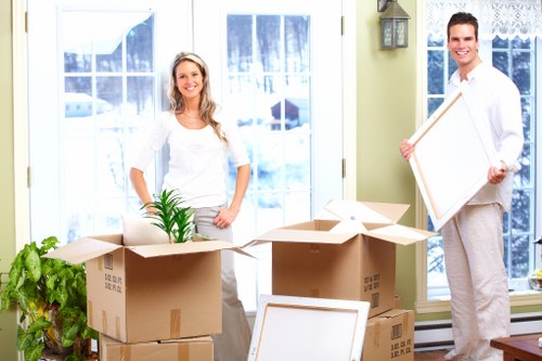 Worker using safe lifting technique during a move