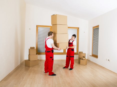 Moving team handling furniture and boxes near Bexleyheath homes